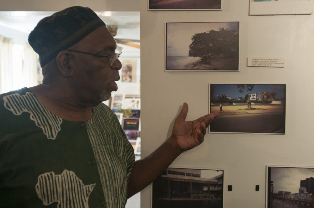 Lansing resident Willie Davis Jr. talks about the value of showing urban areas in Africa on June 29, 2016 at The All Around the African World Museum and Resource Center in Lansing Mich. The photos shown are part of the Africans in Africa exhibit.