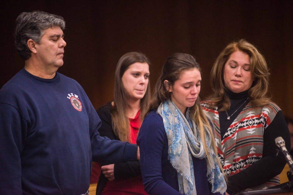 Lauren Margraves addresses the court during her victim impact statement accompanied by her mother, father, and sister and victim Madison Rae Margraves on the second day of sentencing for Larry Nassar on Feb. 2, 2018, in the Eaton County courtroom. Nassar faces three counts of criminal sexual conduct in Eaton. (Annie Barker | State News) 