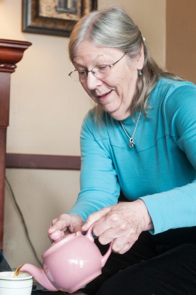 	<p>East Lansing resident Irene Blanchard pours a cup of tea in the front room of Wanderer&#8217;s Teahouse, 547 E. Grand River Ave., on May 12, 2013. The teahouse is set to close Saturday. Danyelle Morrow/The State News</p>