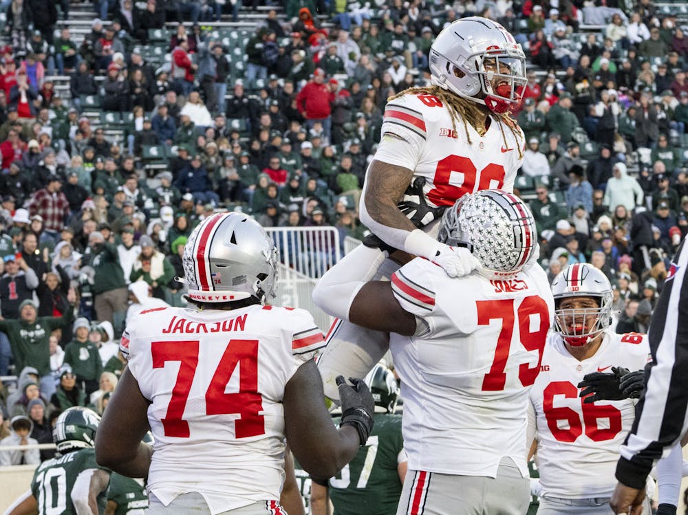 <p>Gee Scott Jr., 88, celebrates an Ohio State touchdown in Michigan State’s game against the Buckeyes on Saturday, Oct. 8, 2022 at Spartan Stadium. The Buckeyes ultimately beat the Spartans, 49-20.</p>
