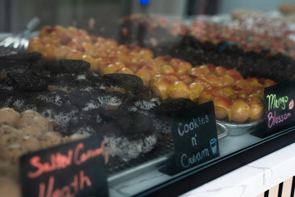 <p>Assorted mochi donut flavors fill the display at Mochinut in East Lansing, Mich., on Sept. 8, 2026.</p>