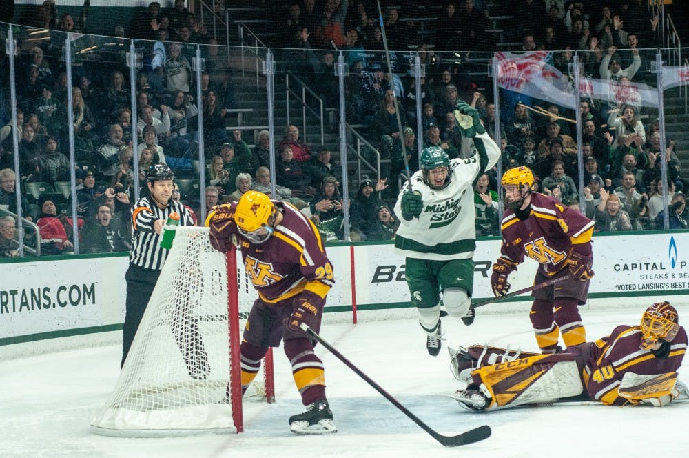 Junior center Patrick Khodorenko (55) celebrates a goal during the game against Minnesota on Jan. 19, 2019 at Munn Ice Arena. The Spartans defeated the Gophers, 5-3.