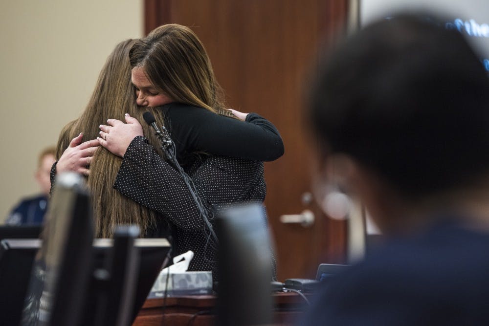 <p>Emma Ann Miller, 15, left, embraces her mother, Leslie Miller, during her statement on the fifth day of Ex-MSU and USA Gymnastics Dr. Larry Nassar's sentencing on Jan. 22, 2018 at the Ingham County Circuit Court in Lansing.</p>