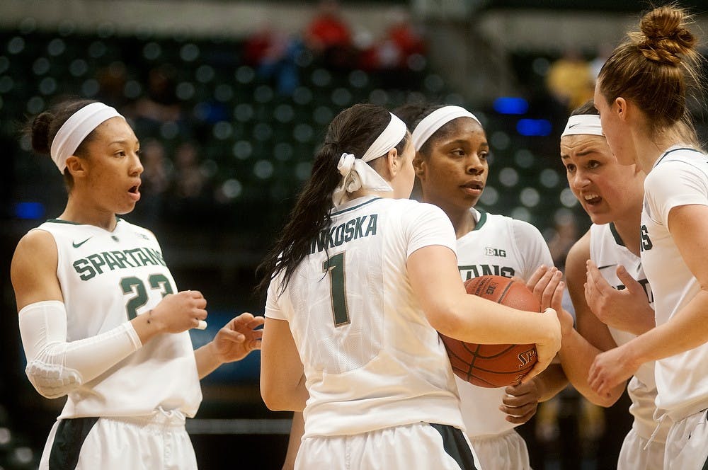 <p>The Spartans huddle up on March 8, 2014, at Bankers Life Fieldhouse in Indianapolis, Ind., to discuss the game plan. MSU lost to Nebraska, 86-58, and plays Hampton on Sunday. Betsy Agosta/The State News</p>