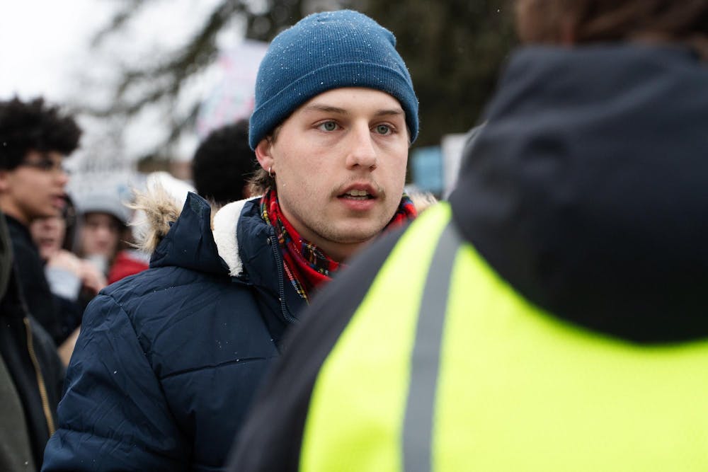 <p>Eli Folts, social relations and policy senior, with students gathering to protest ICE at Michigan State's Spartan Statue in East Lansing, Michigan on Thursday, Jan. 29, 2026.</p>