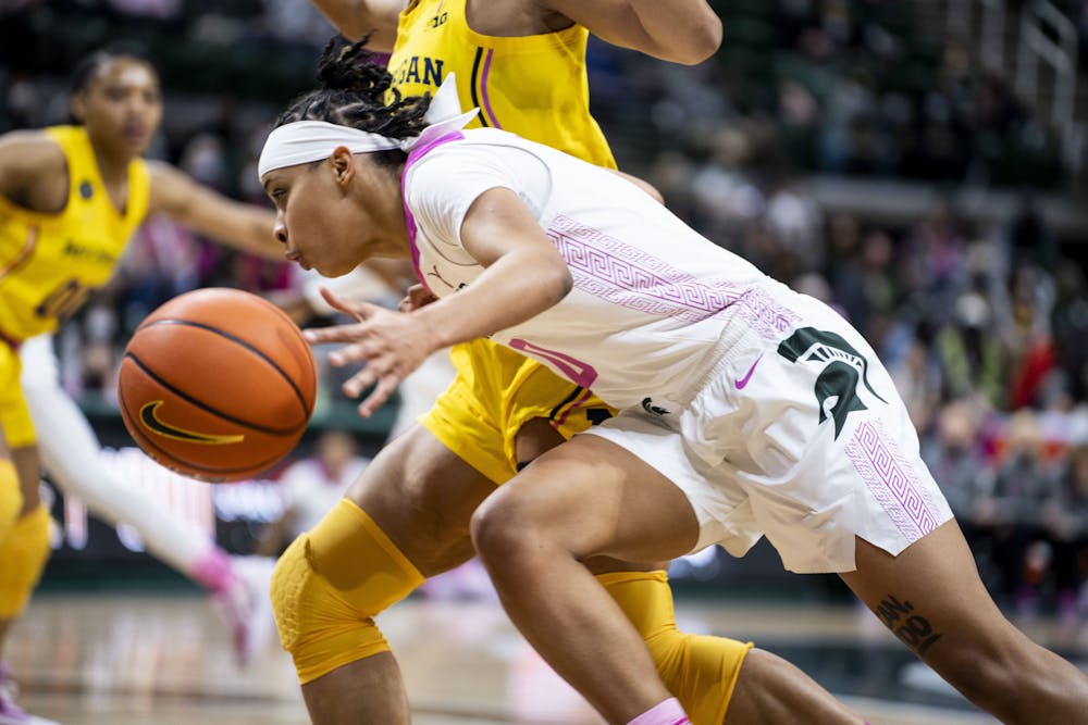 <p>Freshman guard DeeDee Hagemann (0) dribbles the ball during the game against Michigan on Feb. 10, 2022, at the Breslin Center. The Spartans defeated the Wolverines 63-57.</p>
