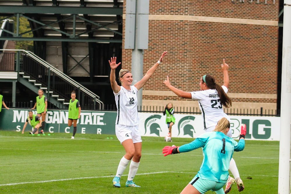 <p>Junior forward Jordyn Wickes (12) and freshman forward/midfielder Bella Najera (23) celebrate the goal Bella made during a game against Ohio State University at DeMartin Soccer Complex on Sept. 17, 2023.</p>
