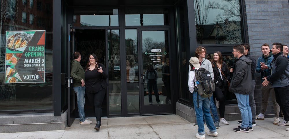 Customers wait outside for Barrio’s grand opening on March 9, 2020.
