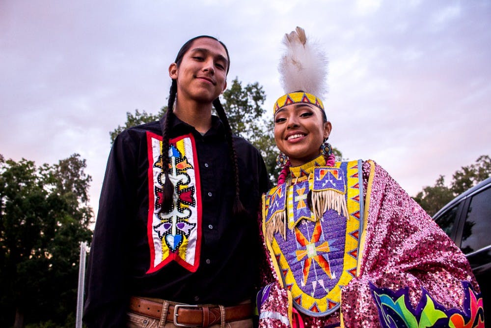 Desmond Madera and human biology senior Beedoskah Stonefish pose for a photo during Spartan Remix on Sept. 6, 2018 at Lot 62 behind Spartan Stadium. The event featured free food, live entertainment, art and gave diverse campus organizations the chance to recruit new members.