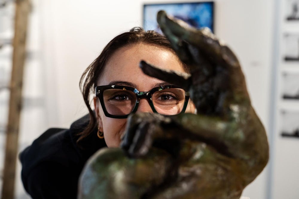 Fourth-year Michigan State studio art student Evan Yalowitz poses with her piece, Obstruction on the Rise, selected for the Scene Metrospace Undergraduate Exhibition, on April 13, 2025. The gallery, where two of her works are featured, is open from April 4-24, 2025.