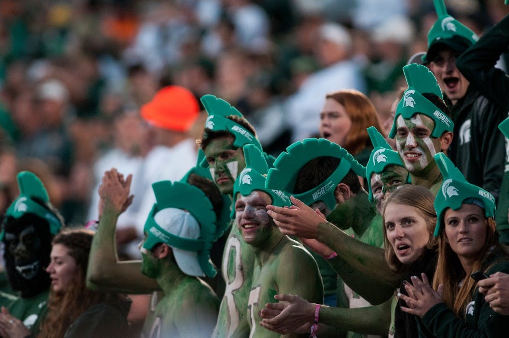 <p>Students cheer during the game against Oregon on Sept. 12, 2015, at Spartan Stadium. The Spartans defeated the Ducks 31-28. Kennedy Thatch/ The State News</p>