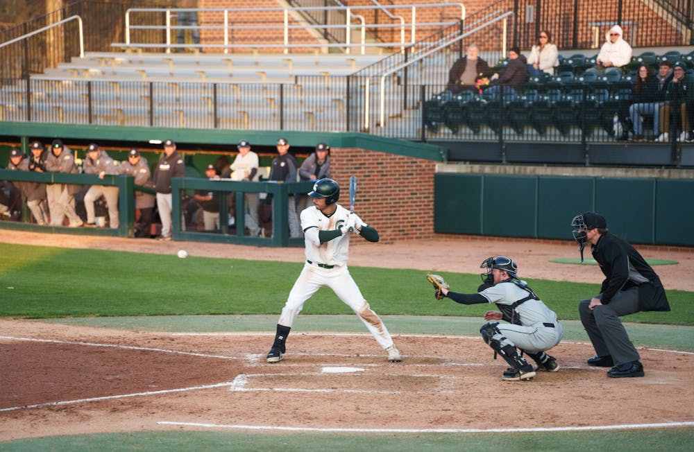Michigan State redshirt senior Peter Ahn (16) being walked after another ball, in the bottom of the fifth. Michigan State won 7-4 against Purdue Fort Wayne at the McLane Stadium, on Apr. 27, 2022.