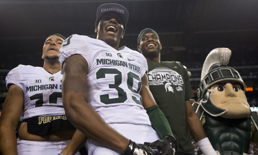 Then-junior Jermaine Edmondson with former Spartans R.J. Shelton and Shilique Calhoun celebrating on Dec. 5, 2015 after the Big Ten Championship game at Lucas Oil Stadium in Indianapolis. Edmondson is suing former basketball player Draymond Green stemming from a July 2016 alleged assault.