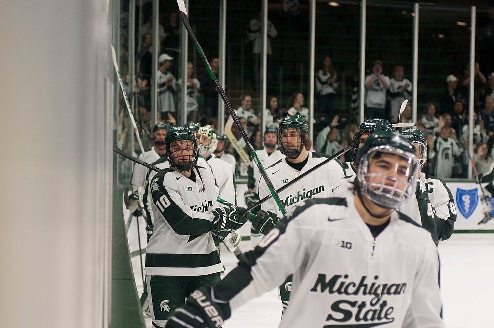 	<p>Spartans skate past the student section at the end of the game against American International, Nov. 3, 2013, at Munn Ice Arena. The Spartans shutout the Yellow Jackets in the second game of the series, 4-0. Danyelle Morrow/The State News</p>