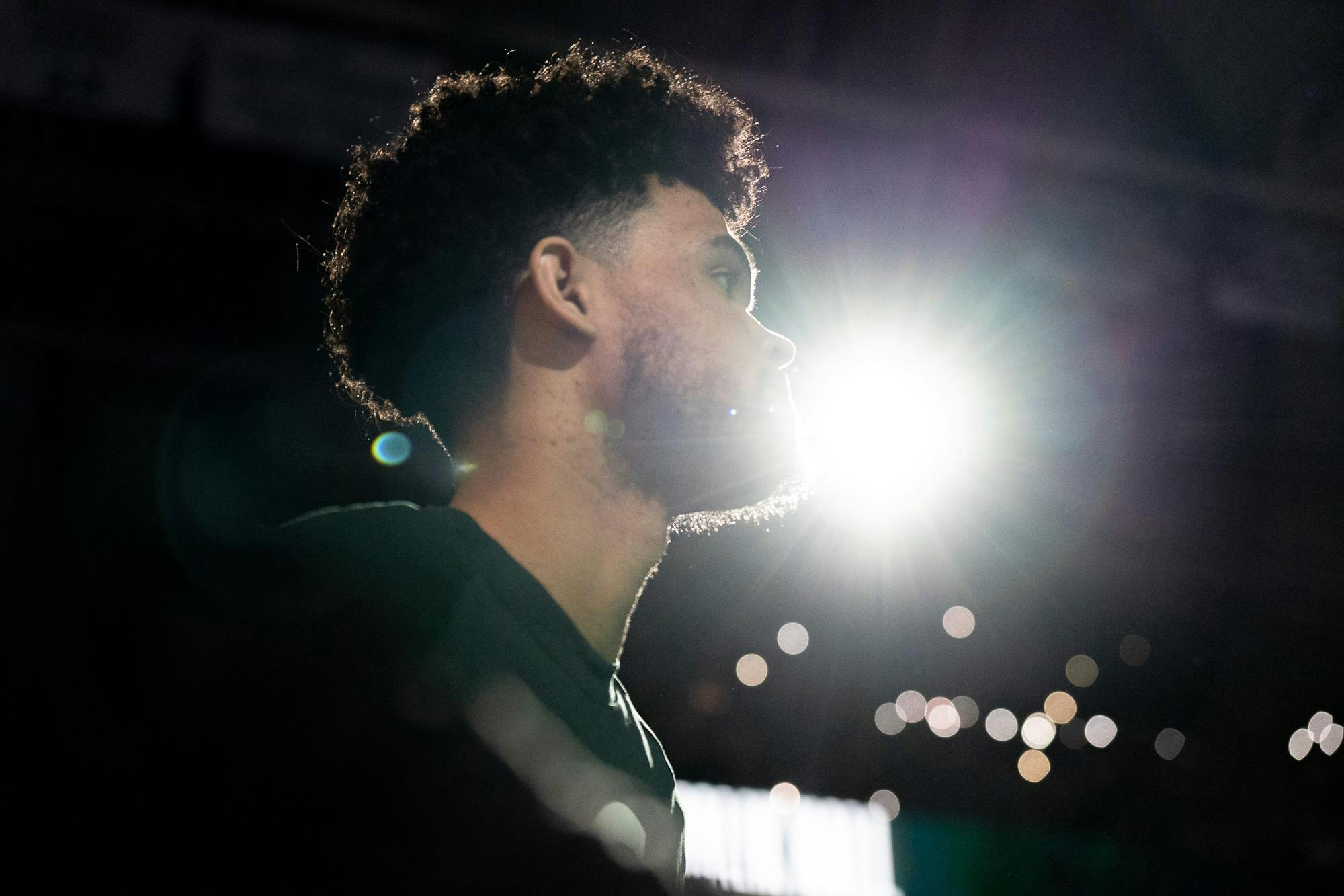 Graduate student Malik Hall (25) goes to the middle of the court after being announced on the starting lineup before  a match against Northwestern University at the Breslin Center on March 6, 2024. The Spartans defeated the Wildcats with a score of 53-49. 