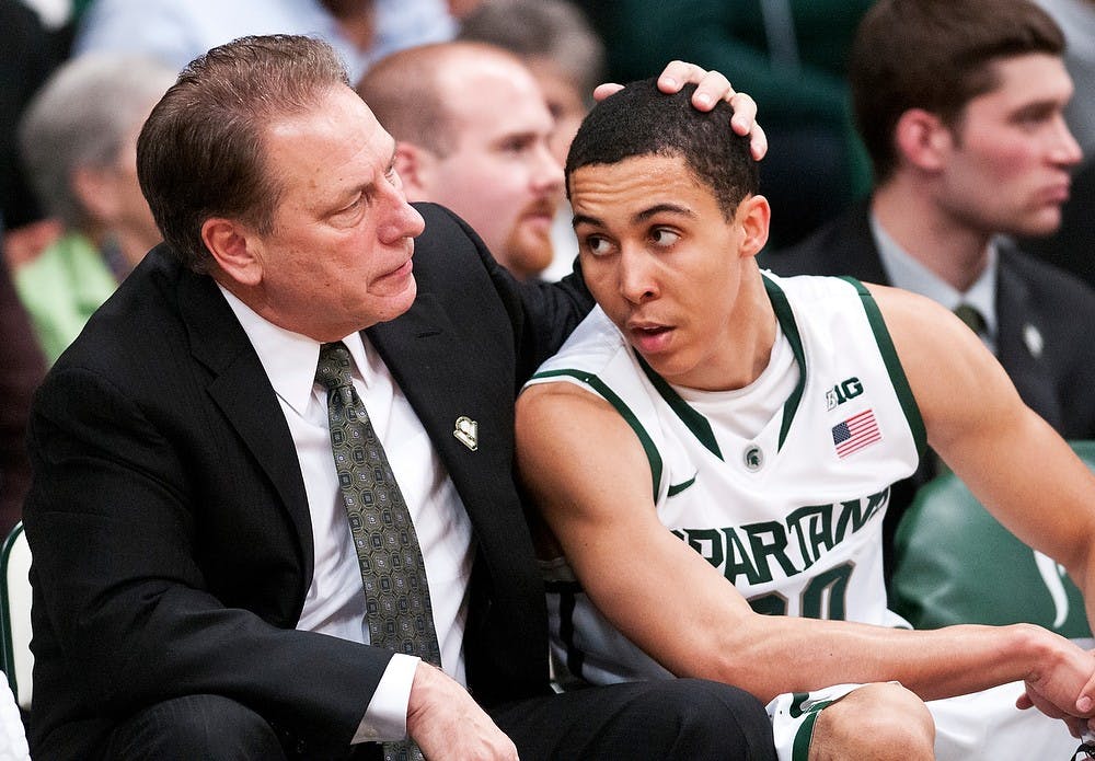 	<p>Head coach Tom Izzo talks with sophomore guard Travis Trice on the bench during the team&#8217;s win over Tuskegee last week. <span class="caps">MSU</span> beat Bowling Green on the road Tuesday night. Adam Toolin/The State News</p>