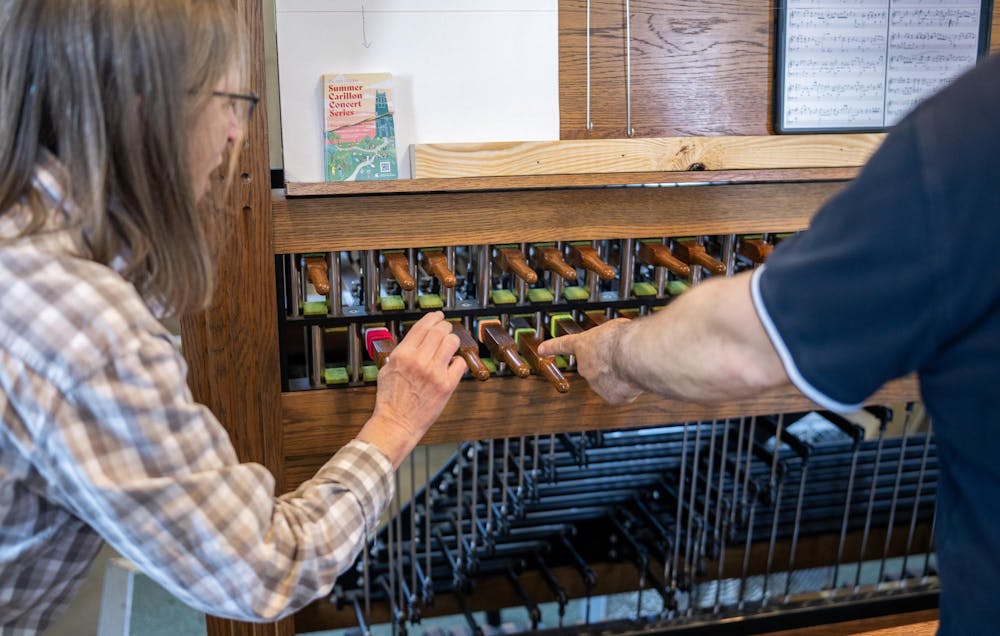 <p>MSU faculty member Danita Brandt is being taught how to play part of "MSU Shadows" on the Carillon by MSU's Carillonist, Jon Jehrer, inside of Beaumont Tower in East Lansing, Mich., on May 28, 2026.</p>