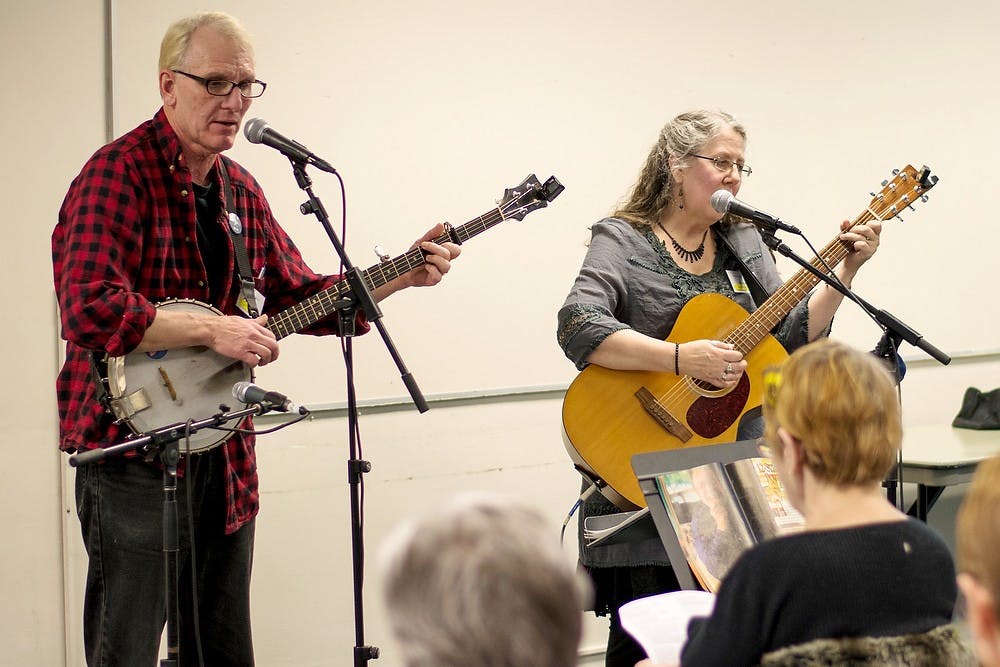 	<p>Lansing musicians Jim Hall and Cindy Morgan lead a &#8220;Songs of Pete Seeger&#8221; workshop during the Mid-Winter Singing Festival at the Hannah Community Center on Feb. 1, 2014.  Workshops were hosted throughout the day as a part of the Ten Pound Fiddle Concert Series.</p>