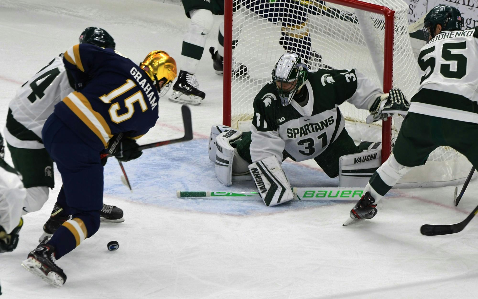 <p>Senior goaltender John Lethemon (31) protects the Spartan goal against right wing Fighting Irish Michael Graham (15). The Spartans upset the Fighting Irish, 3-2, on Nov. 23, 2019. </p>