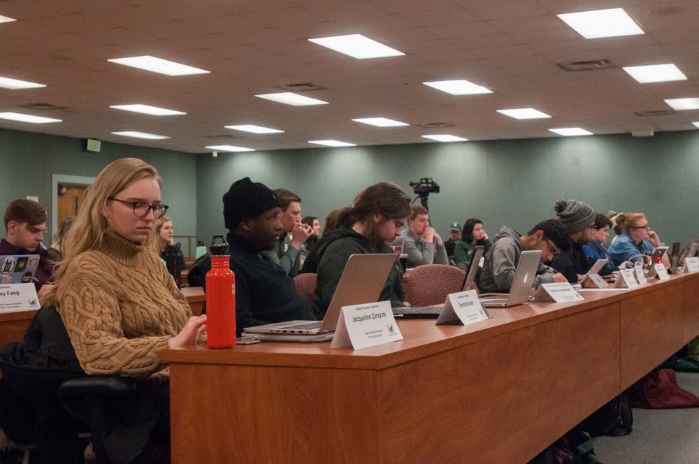 The general assembly sits during the debate about the bill to condemn MSU administration in regards to their handling of the Larry Nassar case on Jan. 18, 2018, at the MSU International Center. The bill passed with a unanimous vote.