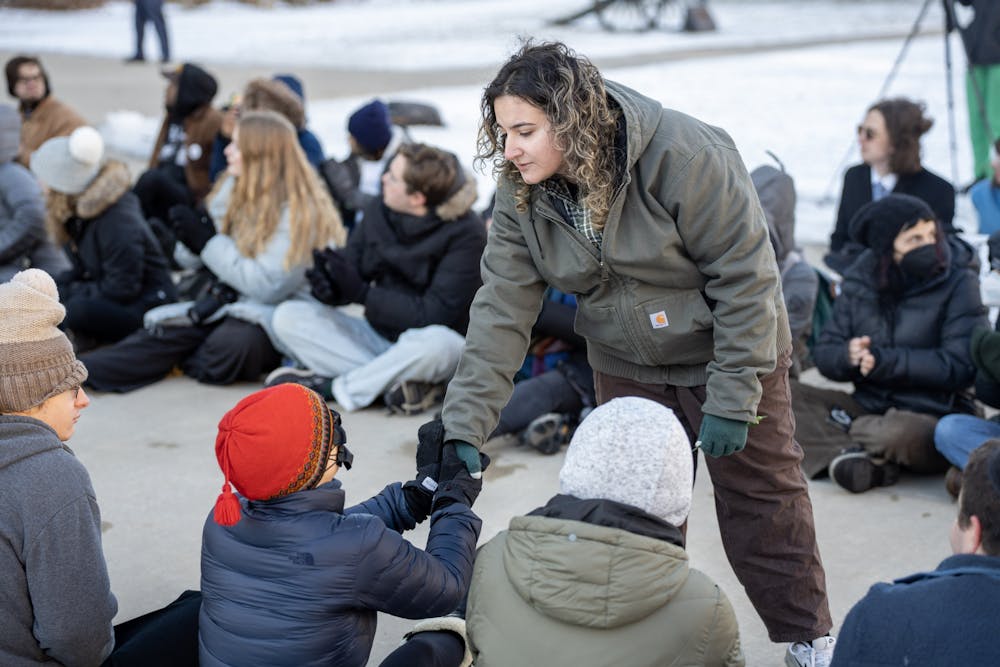 <p>Psychology junior Maya Manuel’s shakes hands with students at the End Gun Violence Spartan Strong Protest at the Michigan Capitol on Feb. 17, 2023.</p>