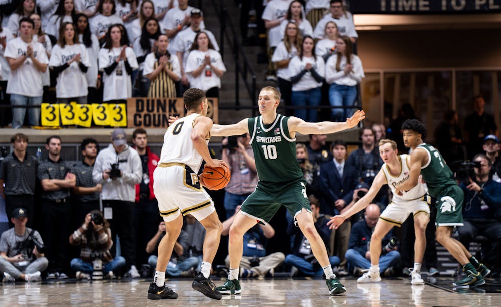 <p>Graduate student forward Joey Hauser (10) guards junior forward Mason Gillis (0) during a game against Purdue at Mackey Arena on Jan. 29, 2023. The Spartans lost to the Boilermakers 77-61.</p>