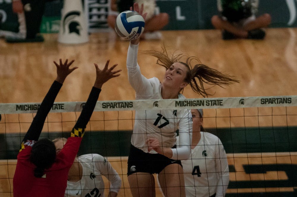 Junior middle blocker Alyssa Garvelink (17) spikes the ball during the game against Maryland on Oct. 8, 2016 at Jenison Field House.  The Spartans defeated the Terrapins, 3-1. 