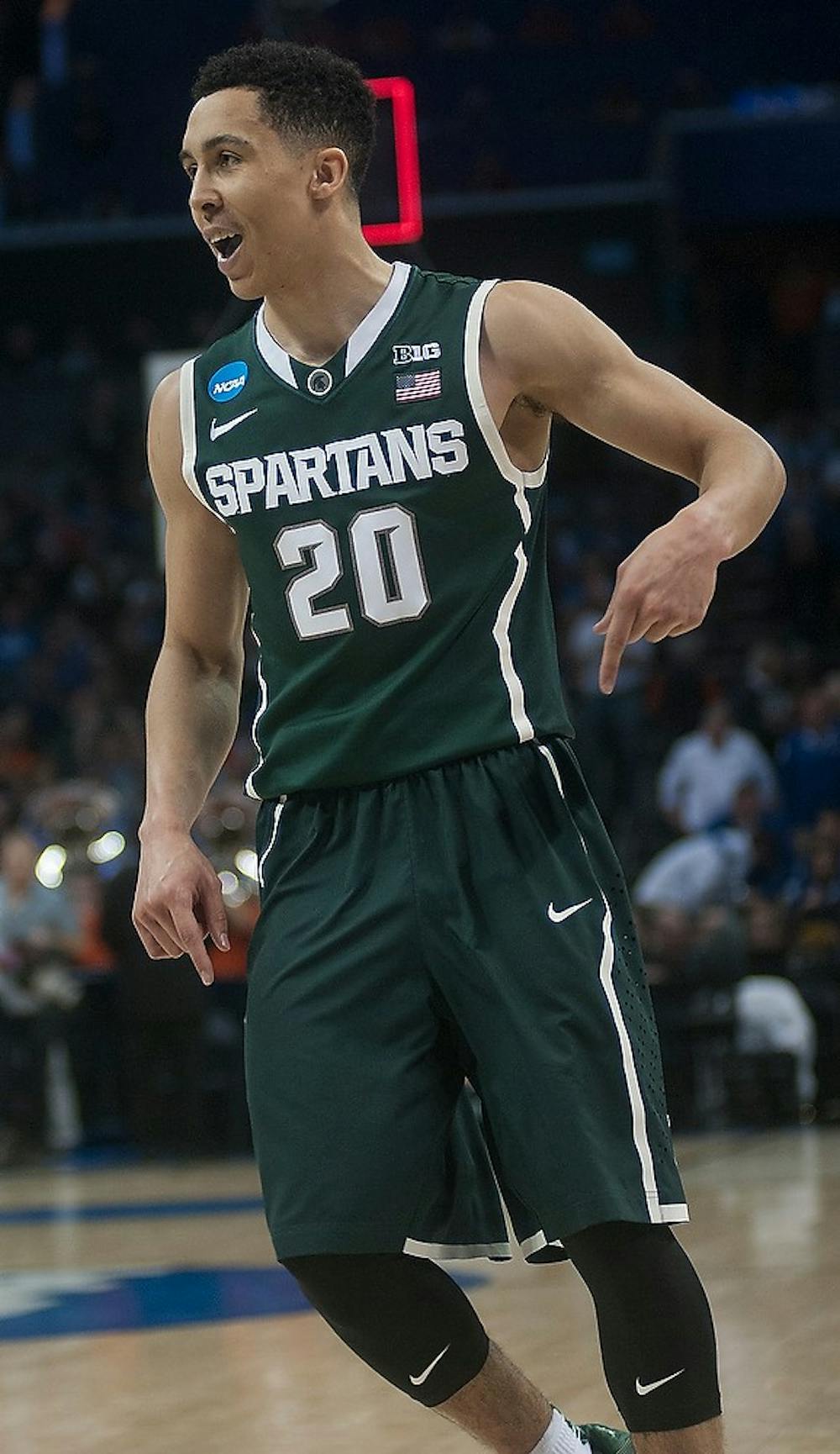 <p>Senior guard Travis Trice celebrates March 22, 2015, during the game against Virginia in the Round of 32 of the NCAA tournament at the Time Warner Cable Arena in Charlotte, NC. The Spartans defeated the Cavaliers 60-54.  Alice Kole/The State News</p>