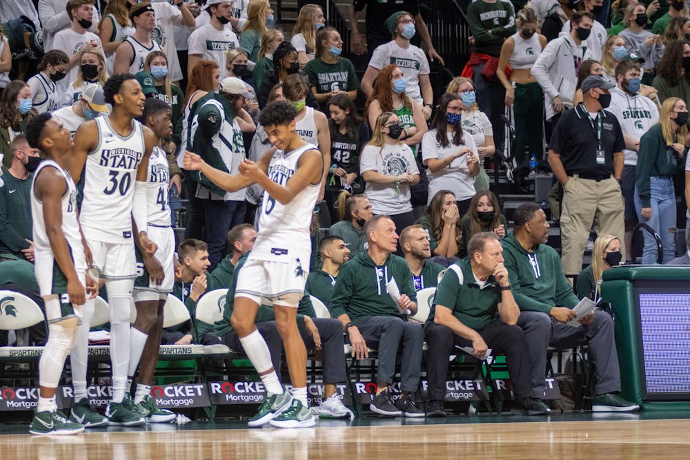 <p>The MSU men&#x27;s basketball team in high spirits during a 83-59 win against Eastern Michigan at the Breslin Center in East Lansing on Nov. 20, 2021.</p>