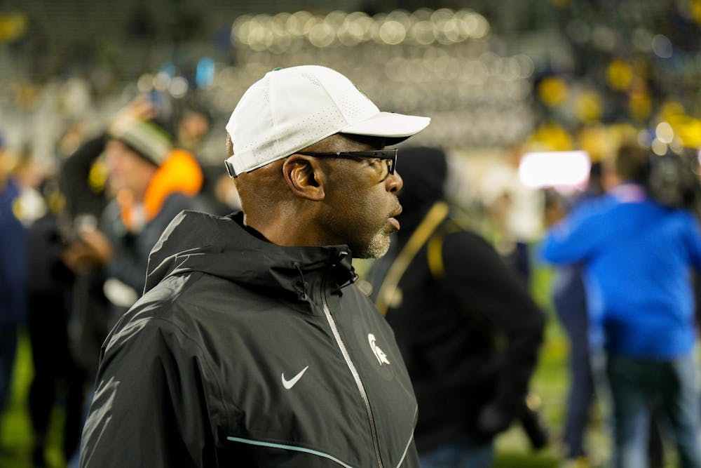 Michigan State Interim Head Coach Harlon Barnett stands on the field of Spartan Stadium after losing to the University of Michigan 49-0 on Oct. 21, 2023.