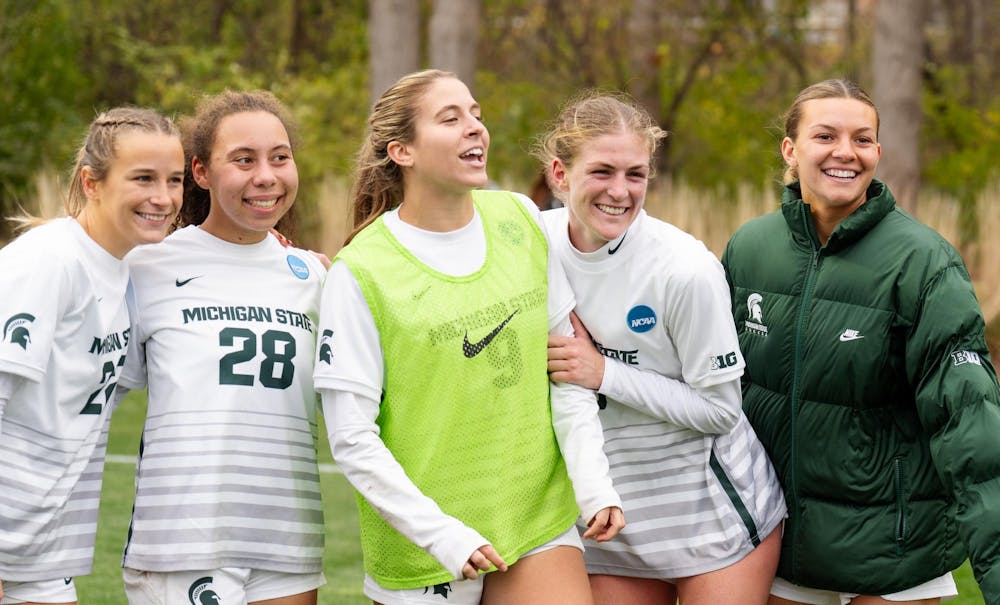 Michigan State University women's soccer players celebrate after the NCAA tournament game against Western Michigan University on Nov. 16, 2024. The Spartans defeated the Broncos, 3-1.