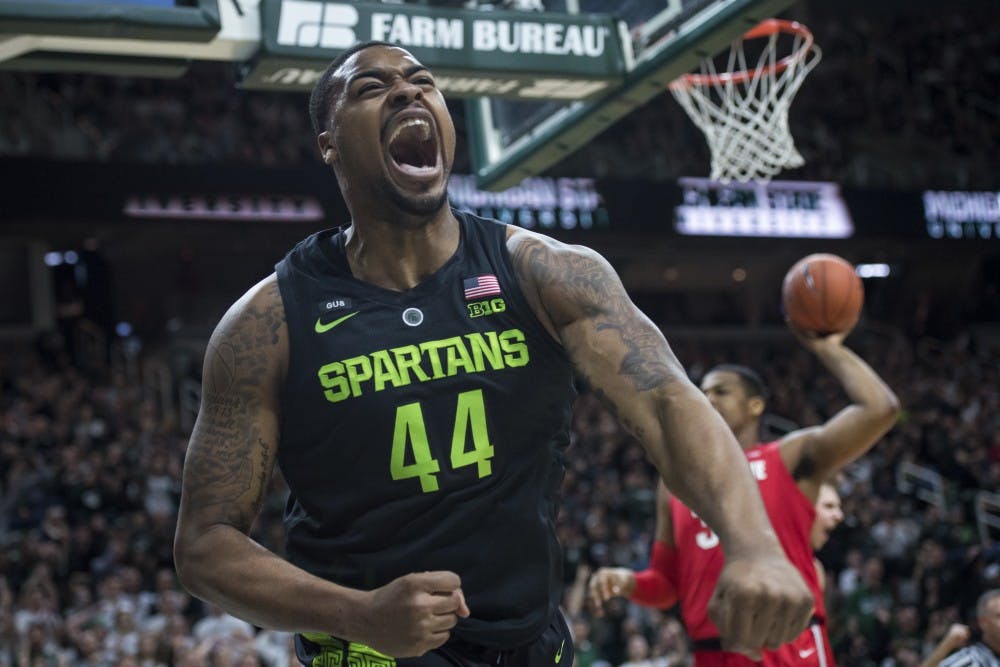 <p>Junior forward Nick Ward (44) celebrates after a basket and a foul during the men's basketball game against Ohio State at Breslin Center on Feb. 17, 2019.</p>