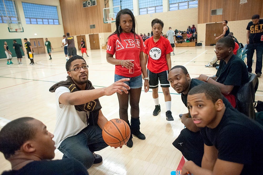 	<p>Advertising junior Resheid Jackson, second left, points toward other <span class="caps">MSU</span> teammates during a timeout as psychology senior Najah Allen and marketing junior Shelia Roby listen during the &#8220;Dropping Dimes for Babies&#8221; basketball game hosted by the National Pan-Hellenic Council against students from Wayne State University on Friday at IM Sports-Circle. </p>