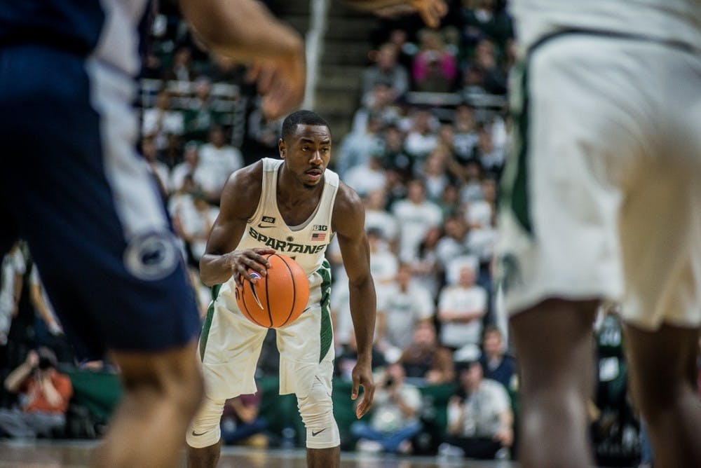 Senior guard Lourawls Nairn Jr. (11) looks for a pass during the game against Penn State on Jan. 31, 2018 at Breslin Center. The Spartans trailed the Nittany Lions at 30-24 at halftime. 