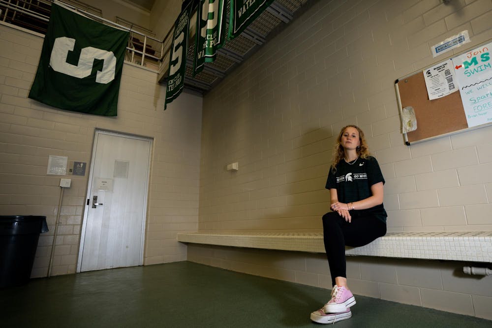 <p>Journalism senior Audrey Richardson sits on the pool bench inside of IM West Fitness Center on Wednesday April 23, 2024. Richardson sat on this bench while watching the swim team practice in 2019 on her recruiting trip. Speaking with her future teammates and watching the team dynamic in the water influenced her decision on joining the program.&nbsp;</p>