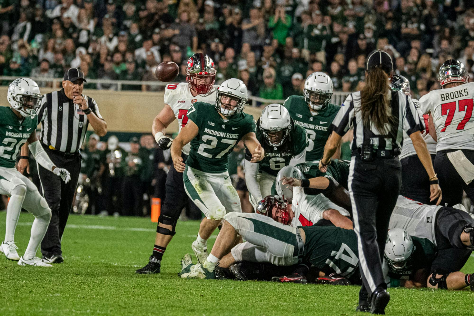 <p>A ball comes loose during the Spartans&#x27; 48-31 homecoming win against Western Kentucky on Oct. 2, 2021.</p>