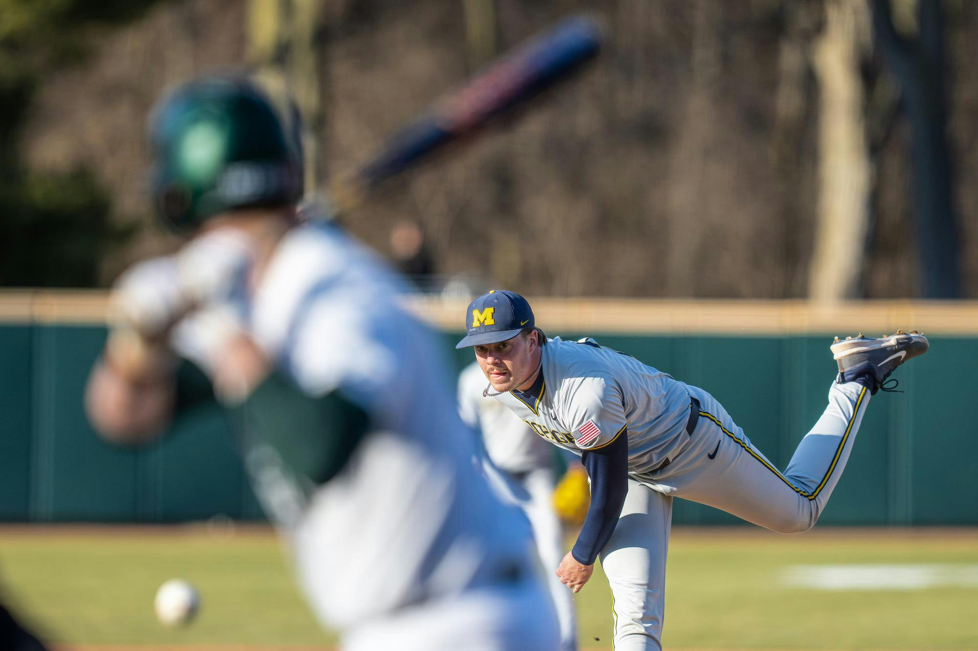 Michigan sophomore pitcher Wyatt Novara (22) throws the ball during a game against Michigan State at McLane Baseball Stadium in East Lansing, Michigan on Mar. 12, 2025