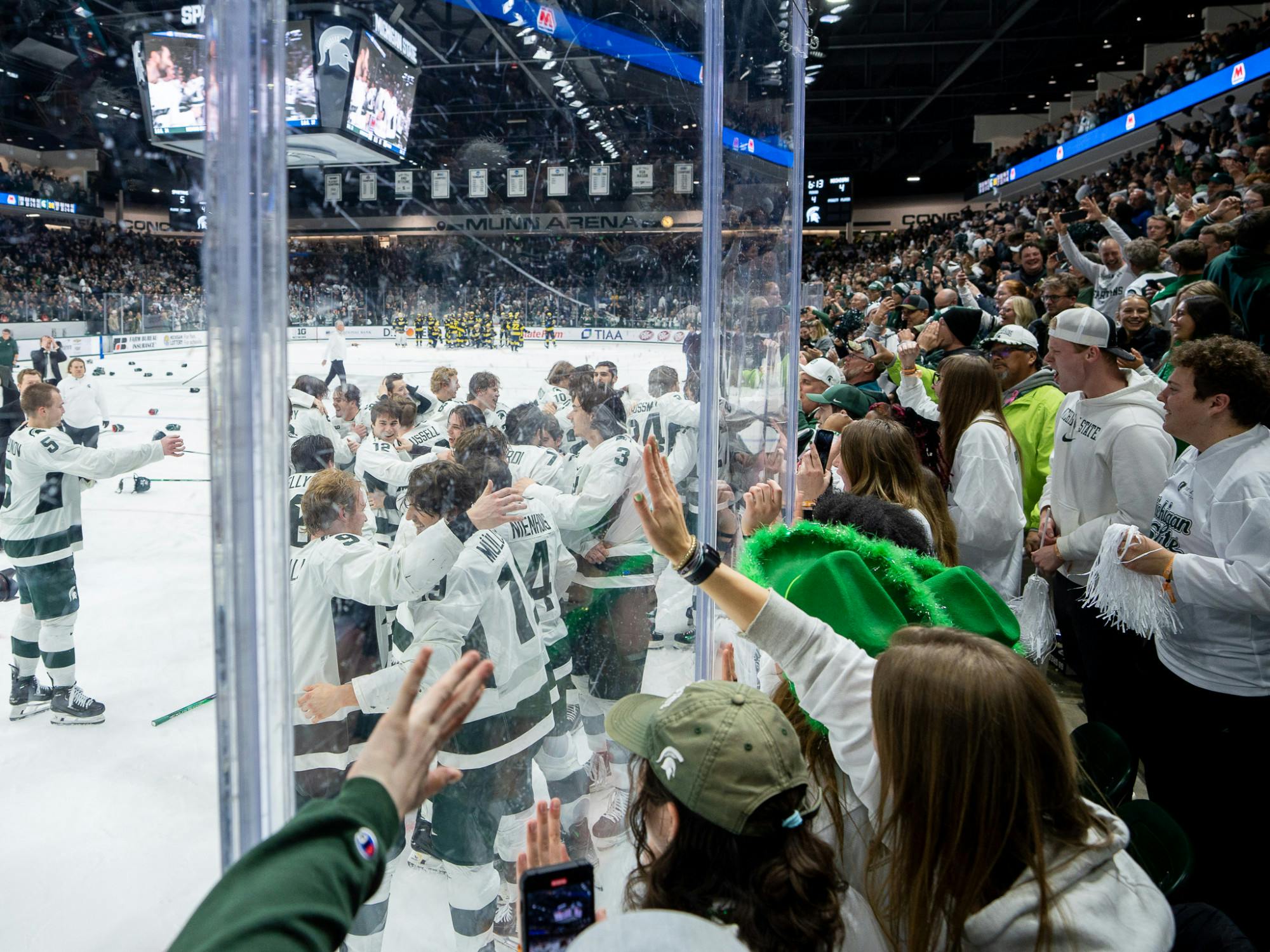 <p>The Spartans celebrate the game-winning goal from freshman defenseman Patrick Geary (2) during a game against University of Michigan at Munn Ice Arena on March 23, 2024. MSU secured the Big Ten Tournament championship with their win over the Wolverines.</p>