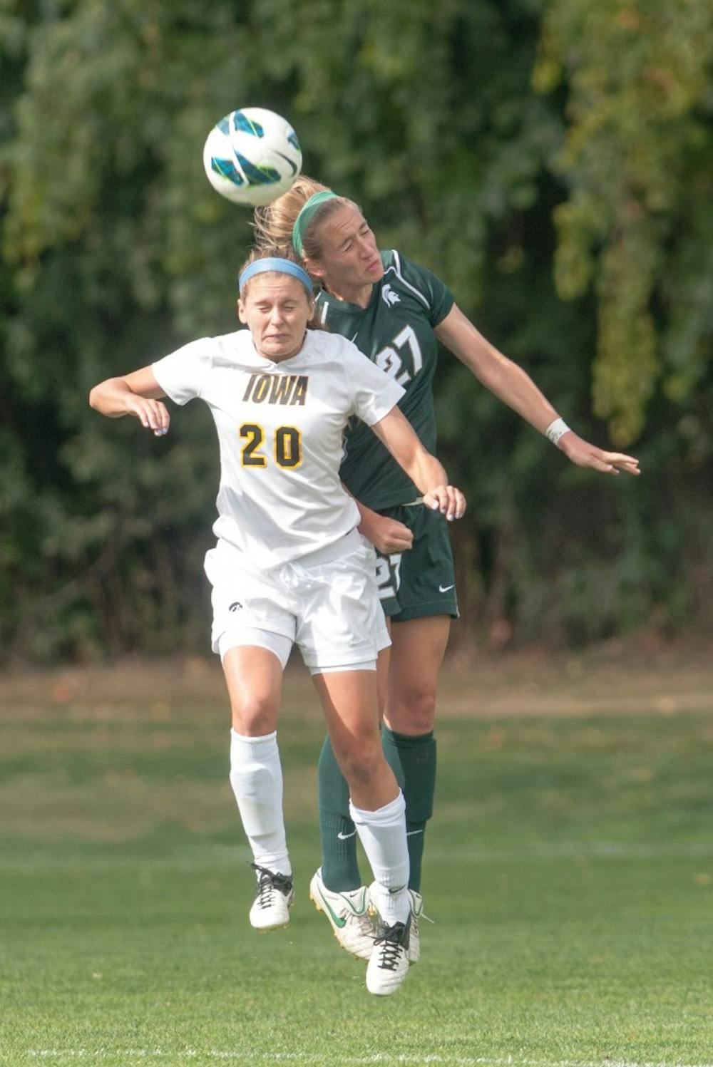	<p>Freshman defender Shauna Stadelmaier makes a header with Iowa Alex Melin in front of her. The Spartans tied with the Hawkeyes, 0-0, on Sunday, Sept. 30, 2012 at DeMartin Stadium. Justin Wan/The State News</p>