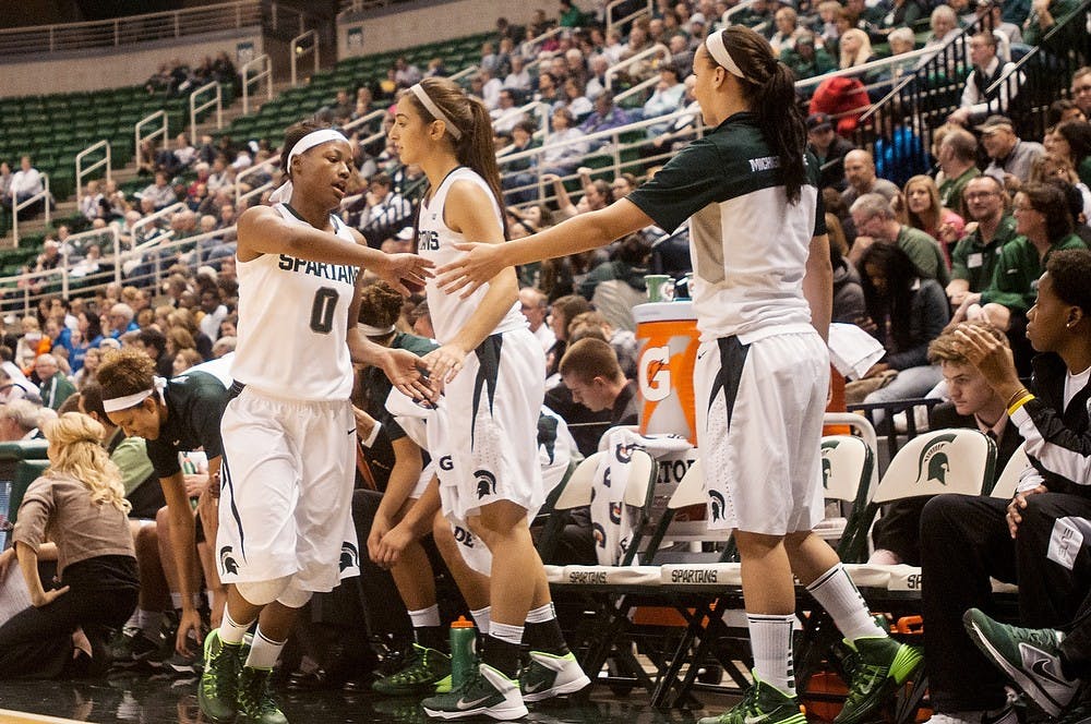 	<p>Junior guard Kiana Johnson high fives her teammates on her way to the bench during the game against Grand Valley State on Nov. 3, 2013, at Breslin Center. The Spartans defeated the Lakers, 91-47. Khoa Nguyen/The State News</p>