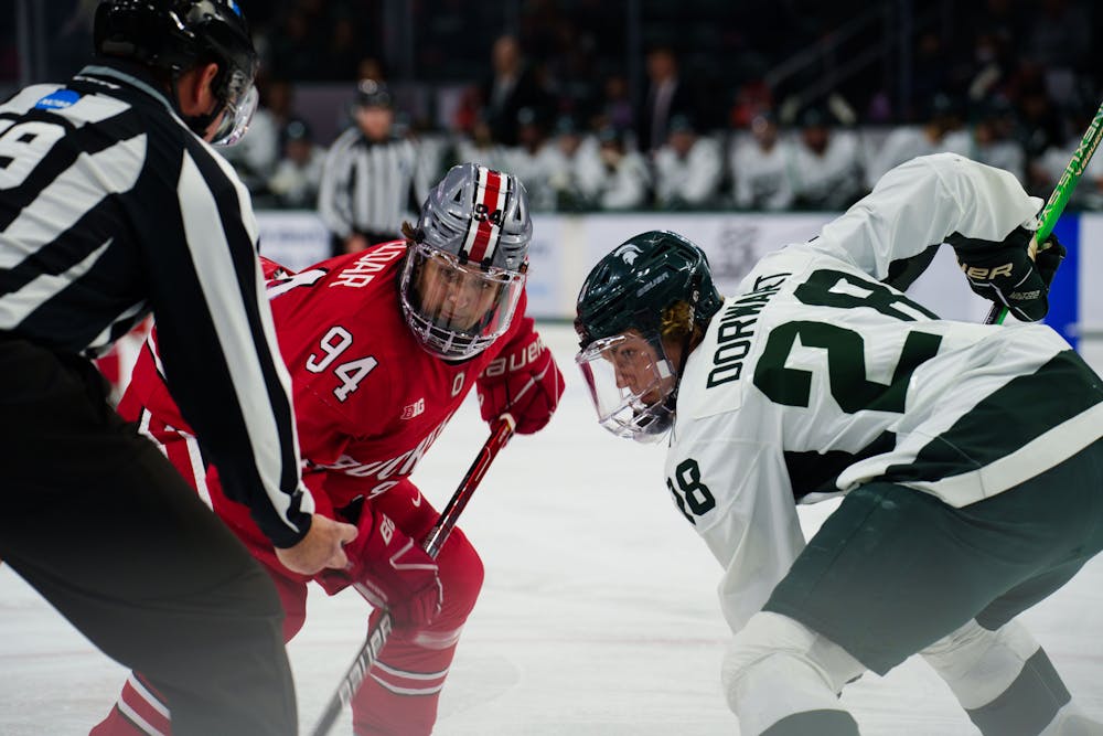 <p>Freshman forward Karsen Dorwart (28) faces off with Ohio State&#x27;s Travis Treloar (94) during the second of a two game series held at Munn Ice Arena on Nov 11, 2022. The Spartans defeated the Buckeyes 4-3.</p>