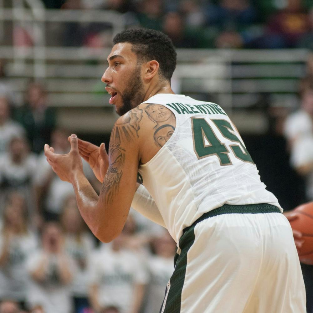<p>Senior guard Denzel Valentine cheers for his teammates on Nov. 9, 2015 during the first half of the game against Ferris State at Breslin Center. The Spartans defeated the Bulldogs, 93-57.</p>