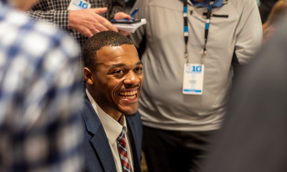 Junior forward Xavier Tillman laughs while being interviewed by the press during Big Ten basketball media day in Chicago on October 2, 2019. 