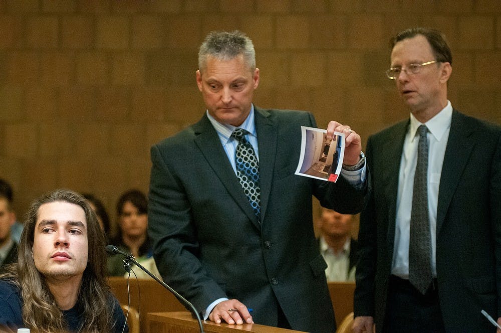 	<p><span class="caps">MSU</span> alumnus Tyler Aho, left, discusses a piece of evidence with Ingham County Assistant Prosecutor John Dewane, middle, and defense attorney Chris Bergstrom, right, during the preliminary exam for the teen accused of stabbing <span class="caps">MSU</span> student Andrew Singler to death, April 18, 2013, at Ingham County District Judge Donald Allen&#8217;s courtroom in Mason, Mich. Aho was Singler&#8217;s roommate and witnessed the altercation. Natalie Kolb/The State News</p>