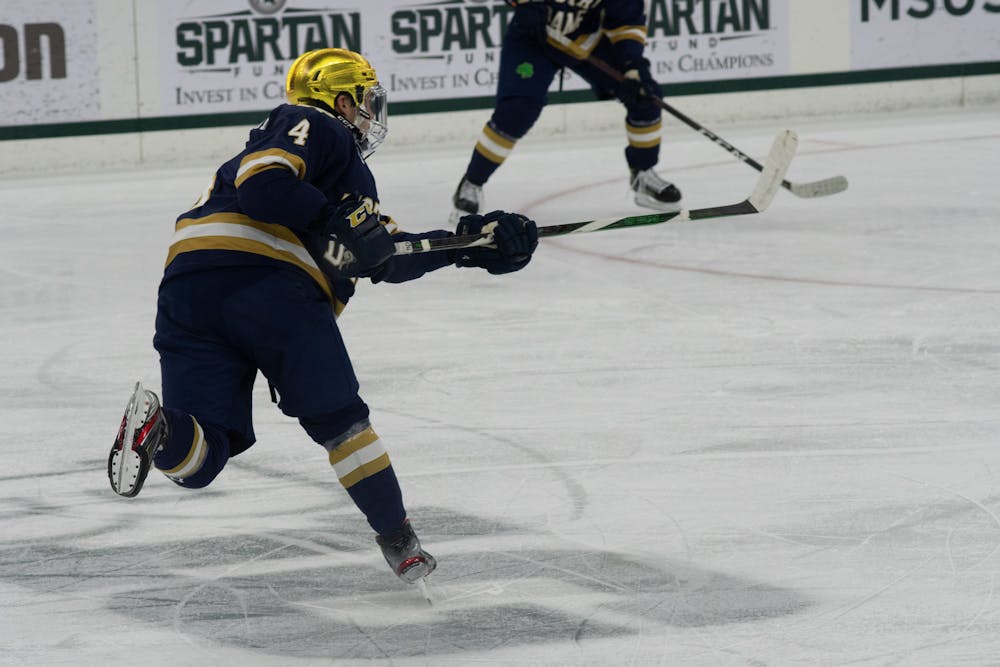 Notre Dame's Nick Leivermann (4) passes the puck during the Spartans' loss to Notre Dame on Feb. 26, 2021.