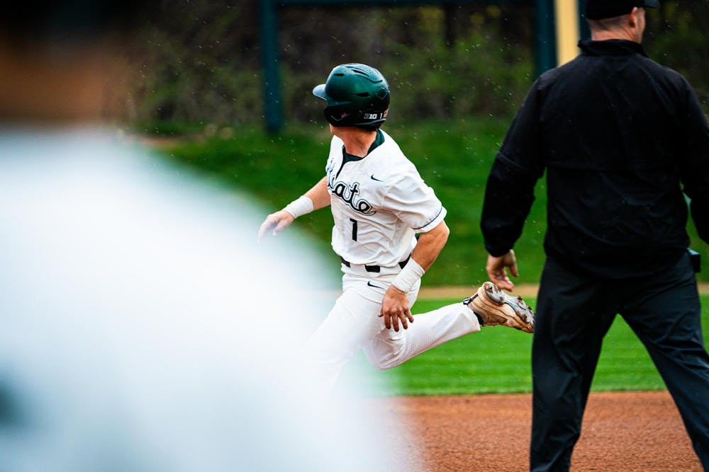 <p>MSU sophomore infielder Ryan McKay (1) tracks the ball while rounding second base during a game at McLane Stadium on April 13, 2025.</p>