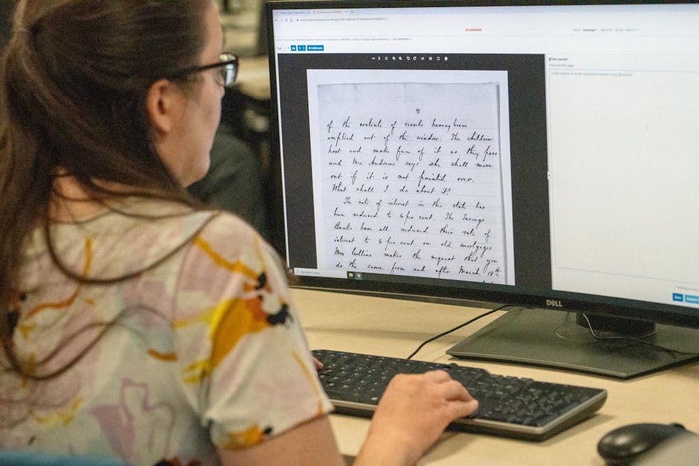 <p>A guest during Frederick Douglass’ transcribe-a-thon works to transcribe one of his correspondences during his birthday even at the MSU Library on Feb. 14, 2024.</p>