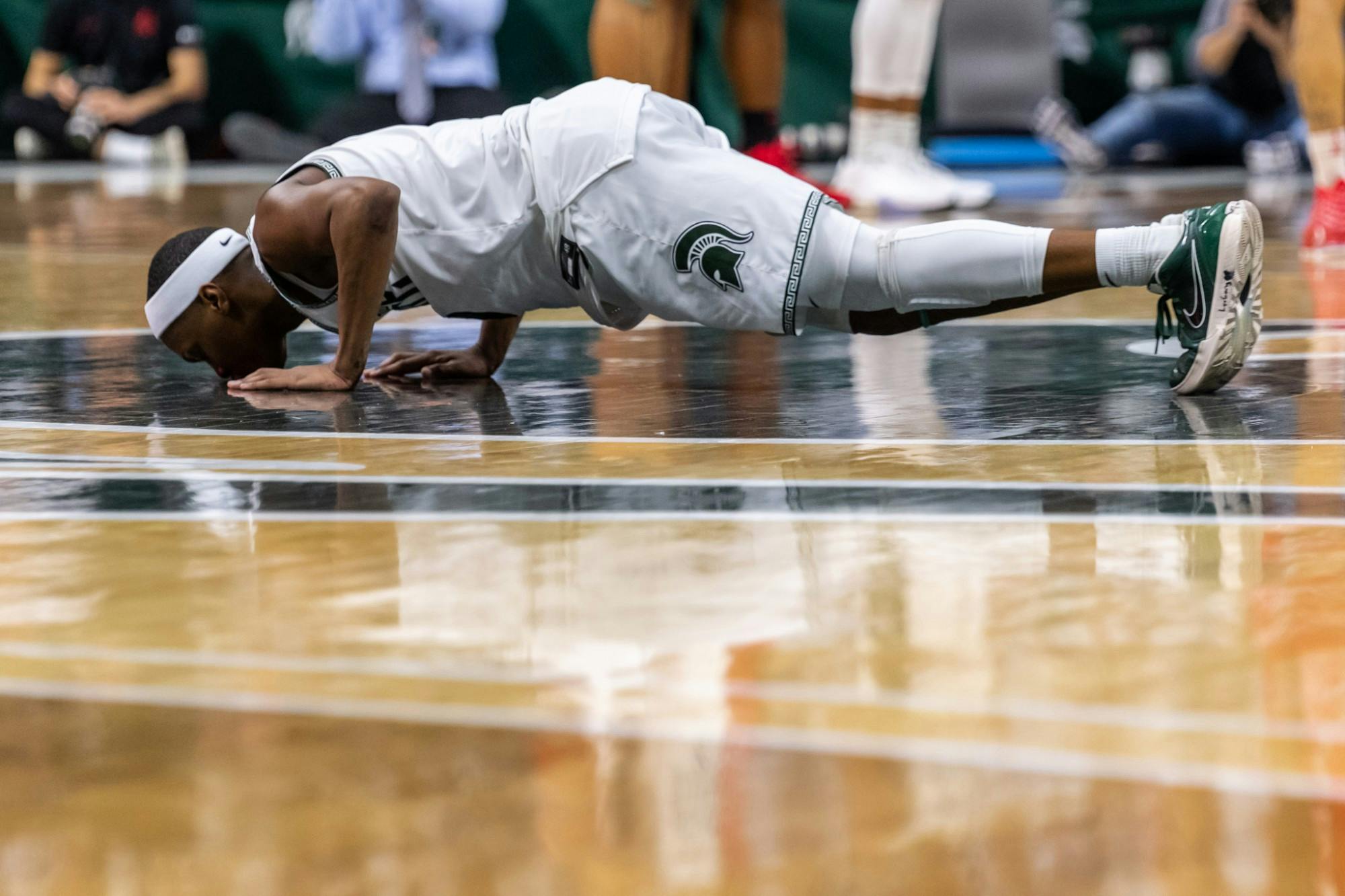 Senior guard Cassius Winston kisses the Spartan head at center court after being subbed out on his senior day. The Spartans defeated the Buckeyes, 80-69, at the Breslin Student Events Center on March 8, 2020. 