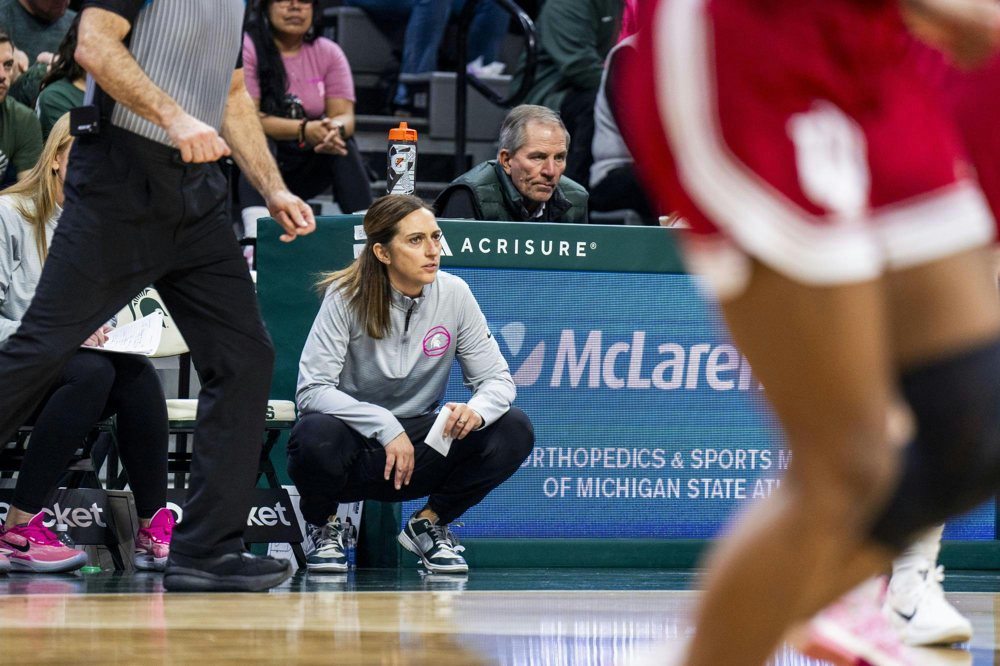 <p>Michigan State women's basketball head coach Robyn Fralick watches the game against Indiana at the Breslin Center on Feb. 23, 2025. The Spartans defeated the Hoosiers 73-65.</p>