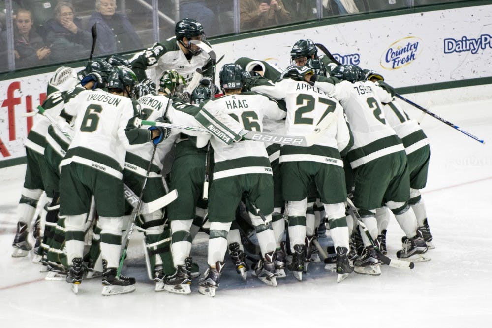 The Spartans huddle before the game against on Jan. 21, 2017 at Munn Ice Arena. The Spartans were defeated by Wolverines, 2-3.